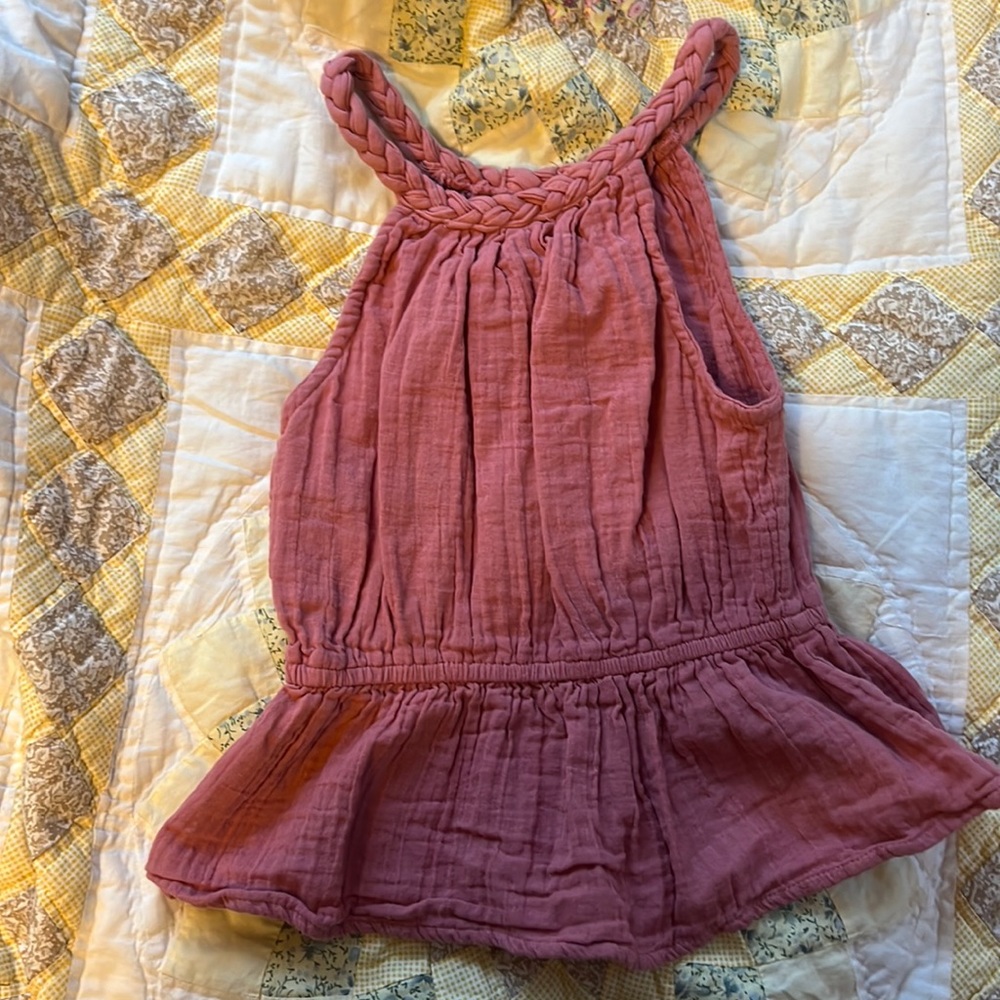 This is a pink/coral XS tank top that was purchased through Sim and Sam.